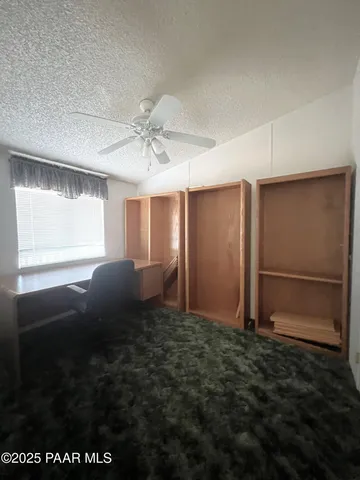 a bathroom with a granite countertop sink toilet mirror and a bathtub