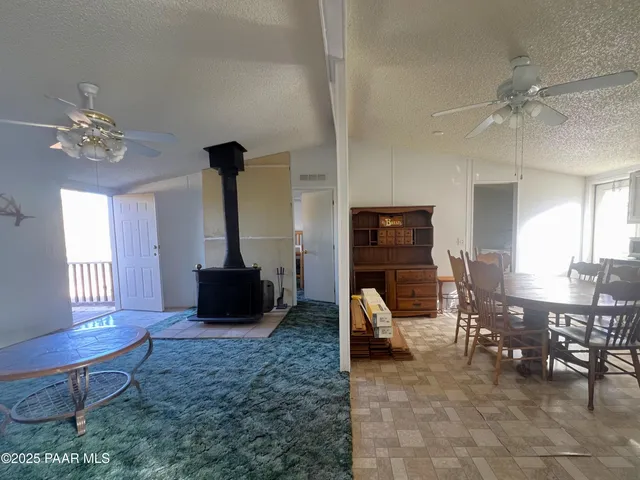 a living room with furniture a fireplace and a table