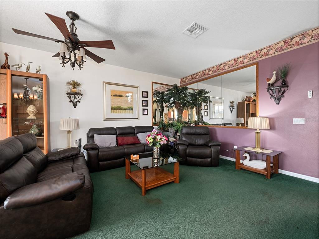 723 Wildflower Road Davenport, FL 33837 - Photo 13 of 34 a living room with furniture