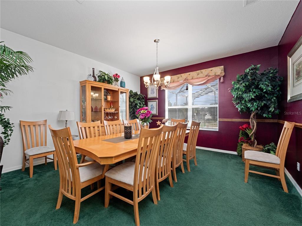 723 Wildflower Road Davenport, FL 33837 - Photo 6 of 34 a view of a dining room with furniture window and outside view
