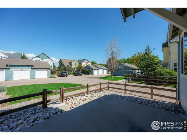 a view of a terrace with wooden bench