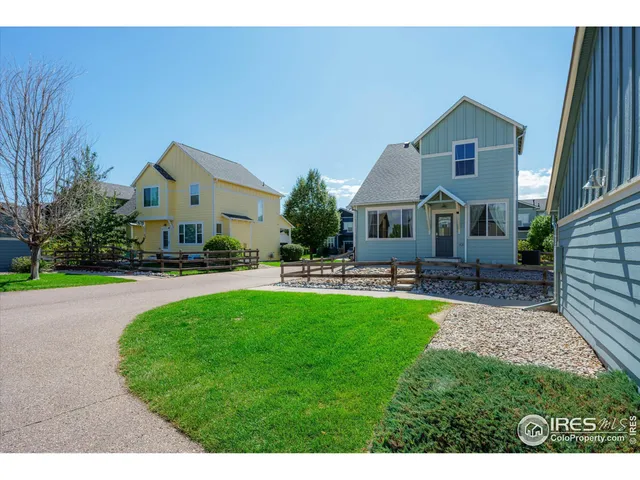 a front view of house with yard and outdoor seating