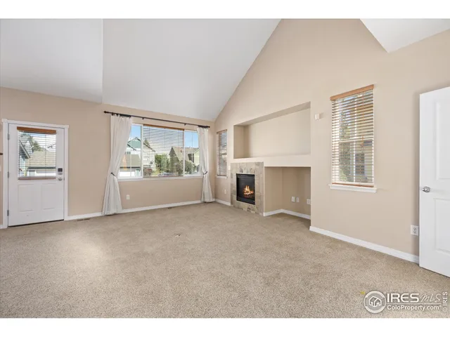 a view of empty room with windows