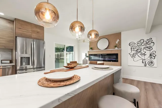 a kitchen with a table and chairs