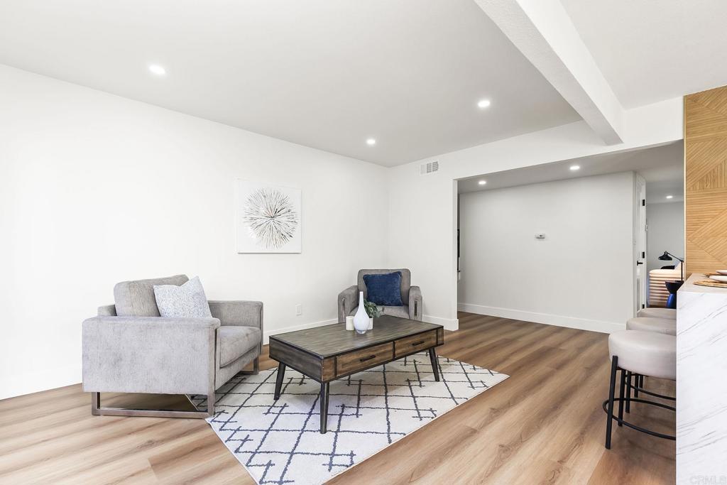 6802 Maury Drive San Diego, CA 92119 - Photo 15 of 44 a living room with furniture and a wooden floor