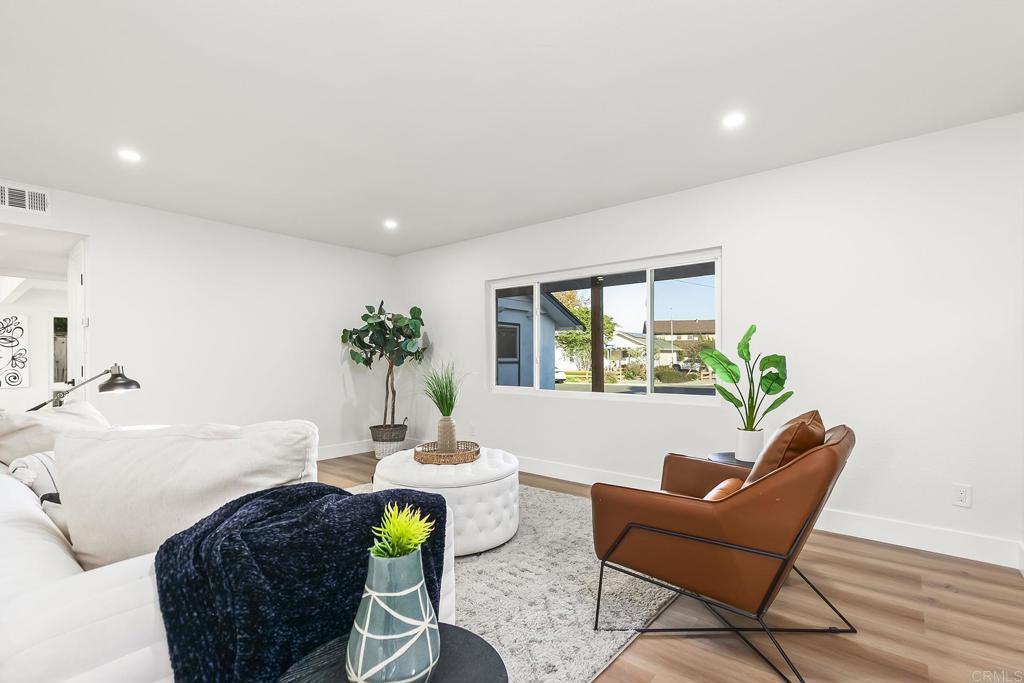 6802 Maury Drive San Diego, CA 92119 - Photo 17 of 44 a living room with furniture a window and a potted plant