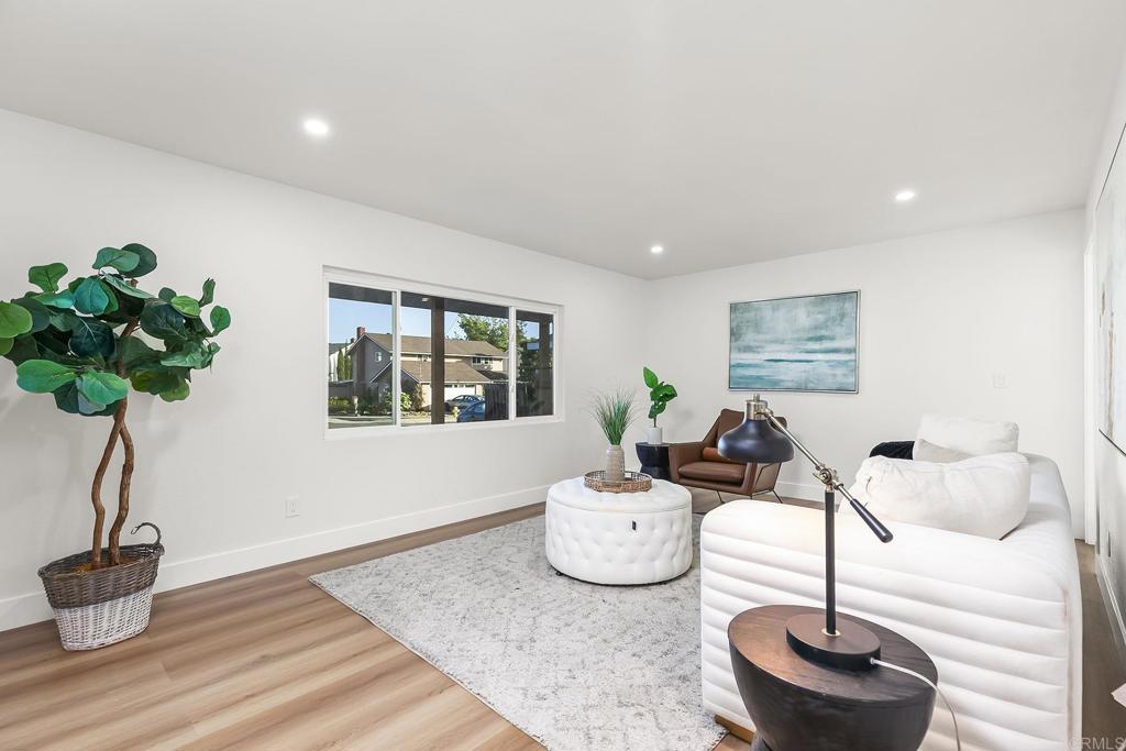 6802 Maury Drive San Diego, CA 92119 - Photo 18 of 44 a living room with furniture and a potted plant