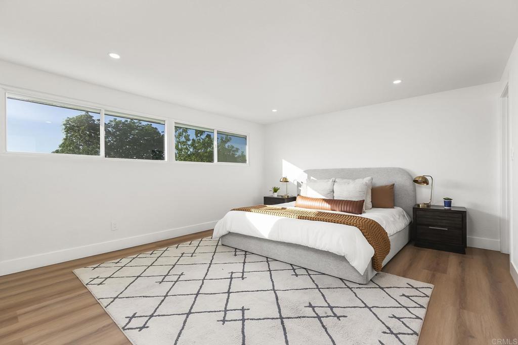 6802 Maury Drive San Diego, CA 92119 - Photo 25 of 44 a bedroom with a bed and a window