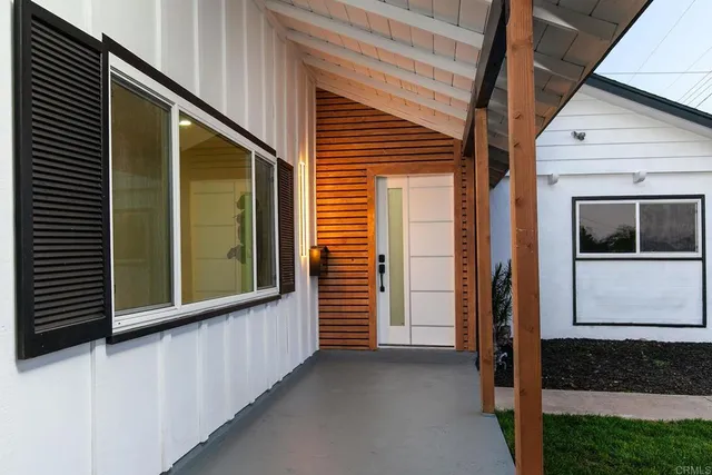 a view of a house with a door and a window