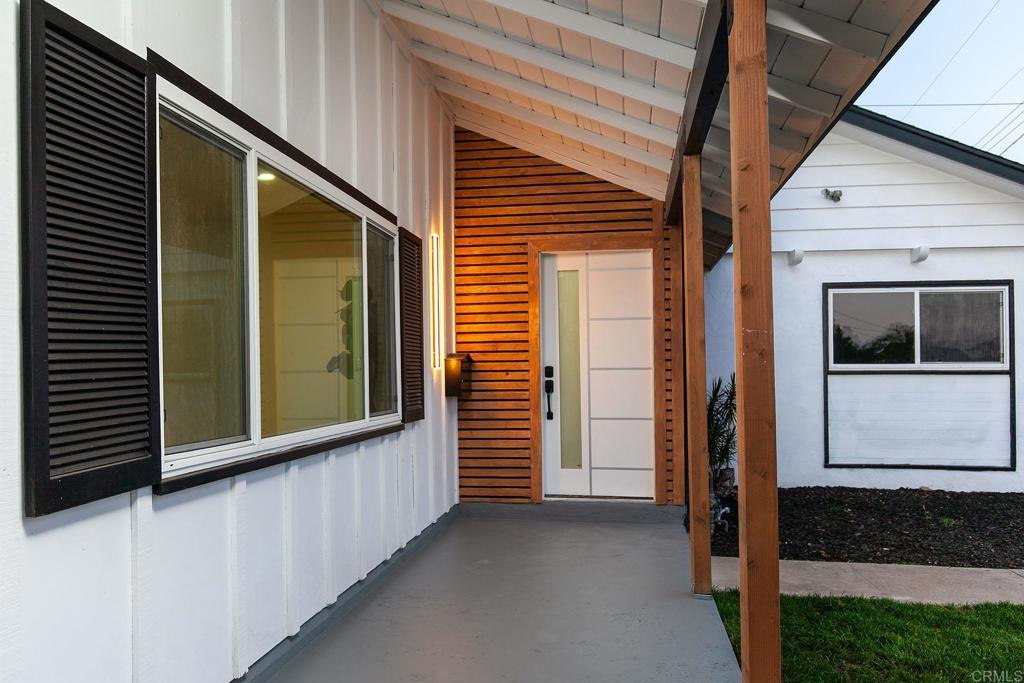 6802 Maury Drive San Diego, CA 92119 - Photo 3 of 44 a view of a house with a door and a window