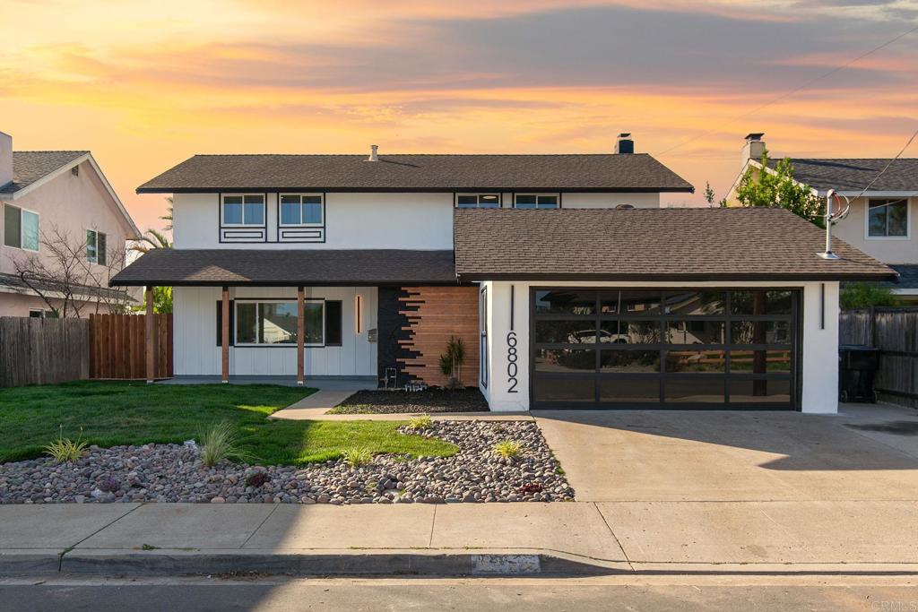 6802 Maury Drive San Diego, CA 92119 - Photo 38 of 44 a front view of a house with garden
