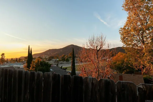 a view of a house with a mountain yard
