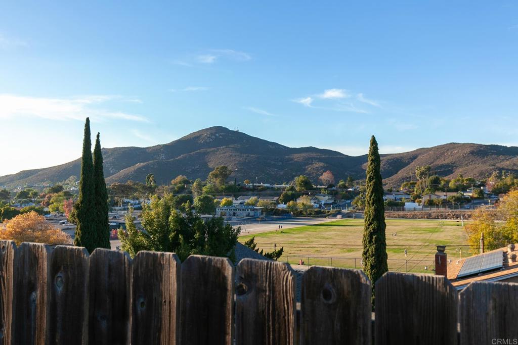 6802 Maury Drive San Diego, CA 92119 - Photo 40 of 44 a view of a lake with a mountain in the background