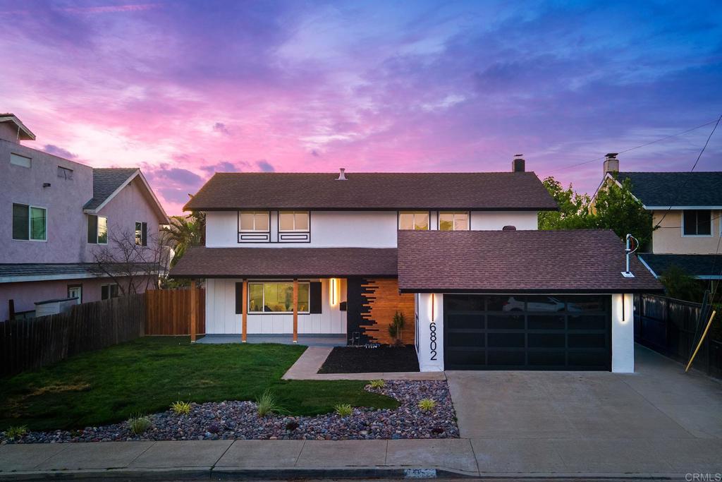6802 Maury Drive San Diego, CA 92119 - Photo 42 of 44 a front view of a house with a garden and yard
