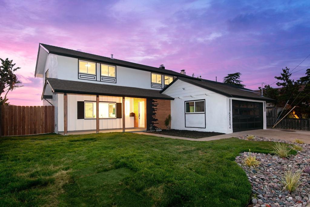6802 Maury Drive San Diego, CA 92119 - Photo 43 of 44 a front view of a house with a yard