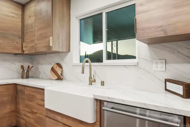a kitchen with a sink and a window