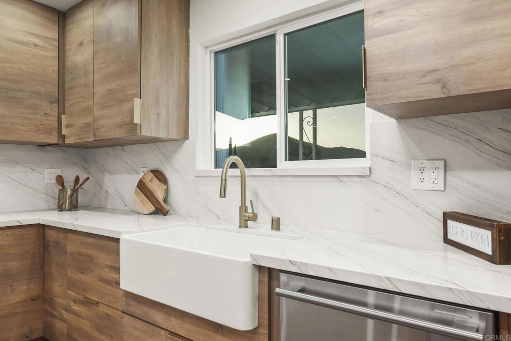 6802 Maury Drive San Diego, CA 92119 - Photo 6 of 44 a kitchen with a sink and a window