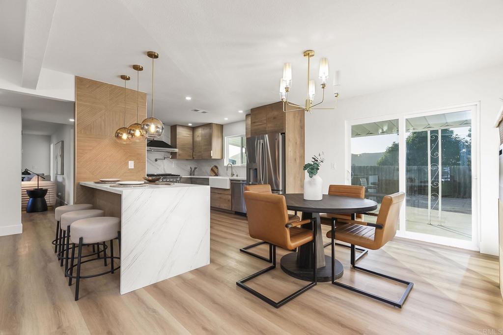 6802 Maury Drive San Diego, CA 92119 - Photo 9 of 44 a view of a dining room with furniture window and wooden floor
