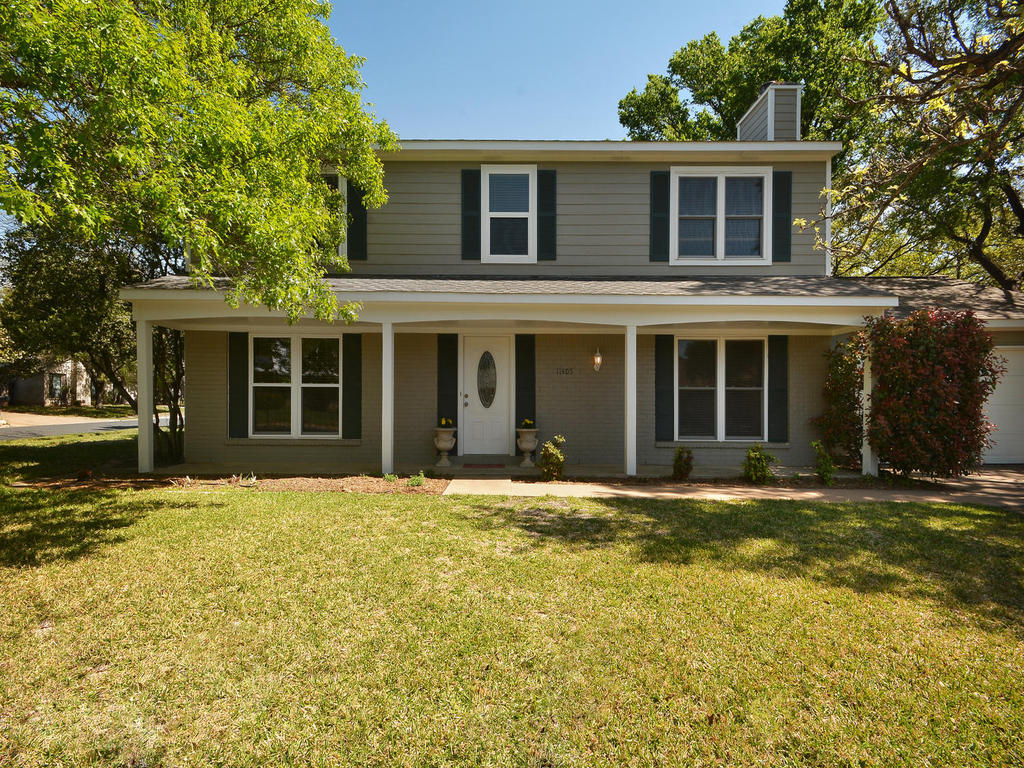 11405 Pyreneese Drive Austin, TX 78759 - Photo 1 of 1 front view of a brick house with a large windows