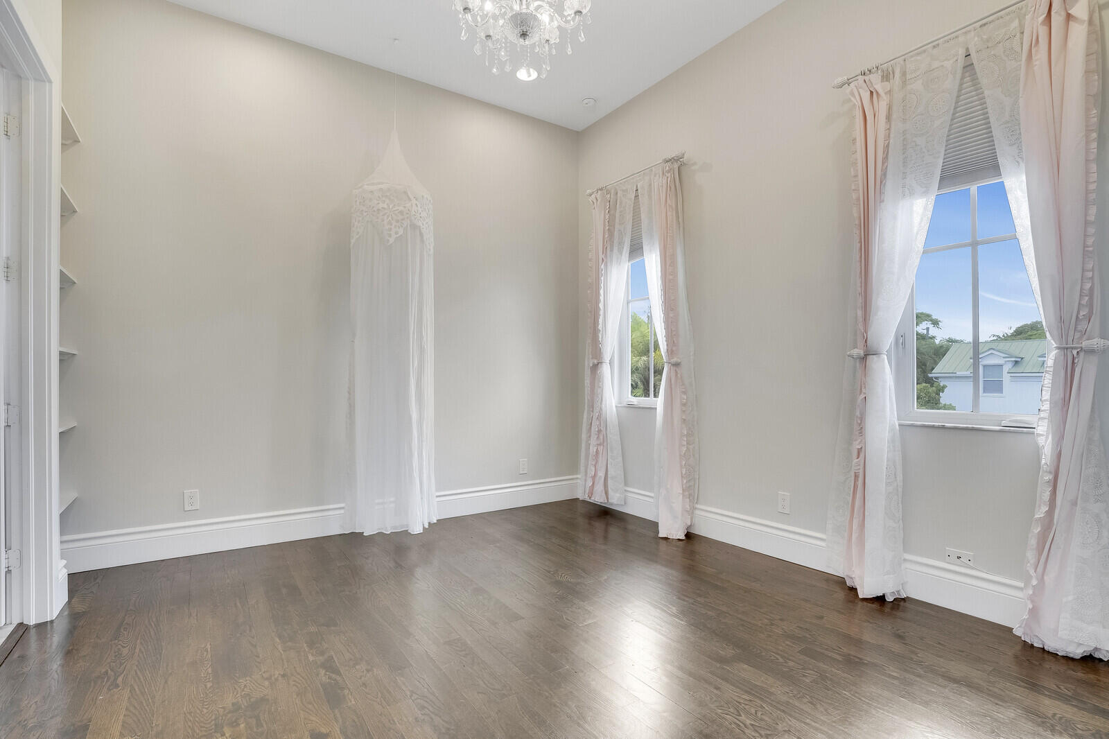 200 Northwest 10th Street Boca Raton, FL 33432 - Photo 26 of 76 an empty room with wooden floor and windows