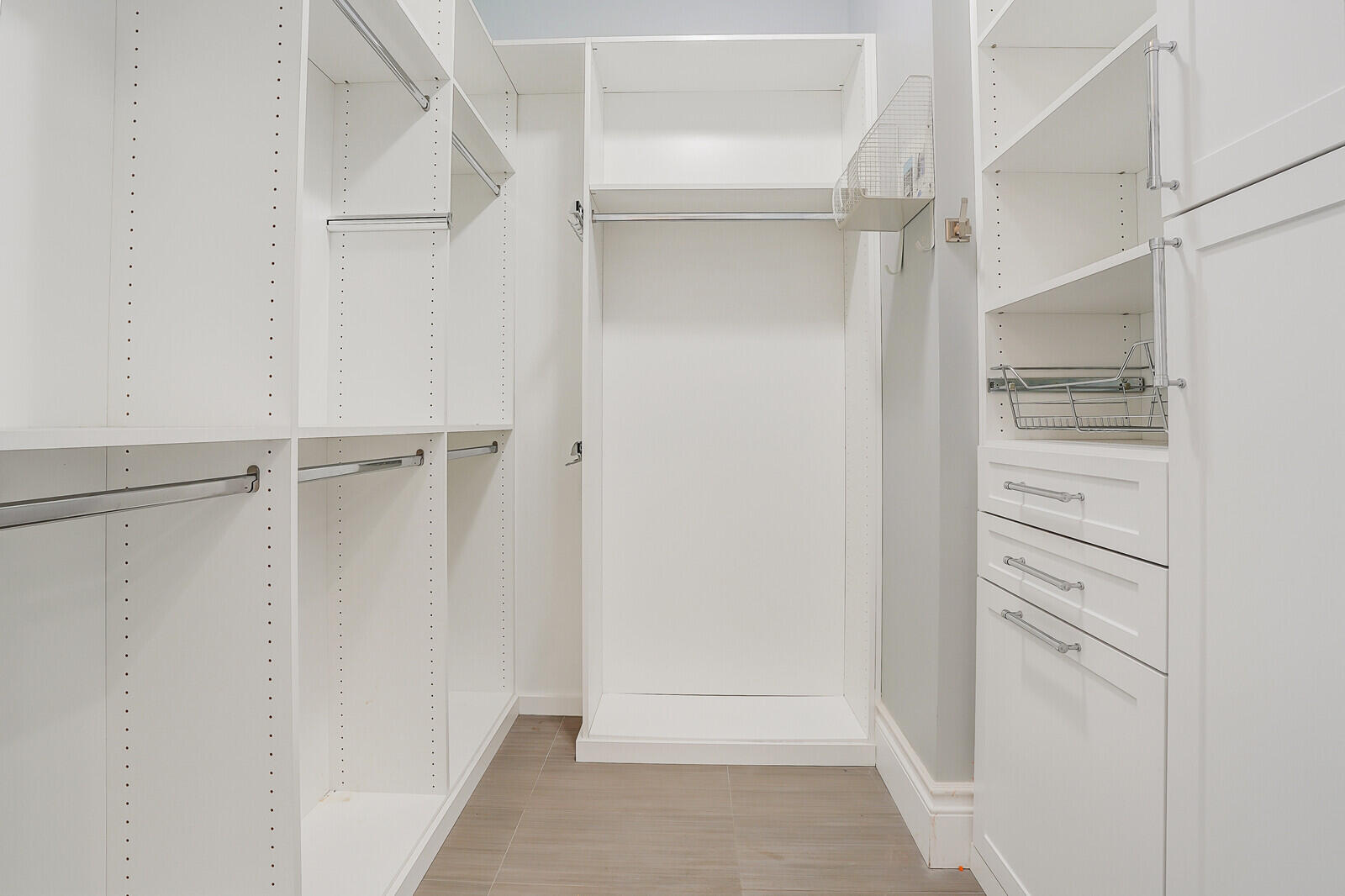 200 Northwest 10th Street Boca Raton, FL 33432 - Photo 32 of 76 a view of walk in closet with empty racks