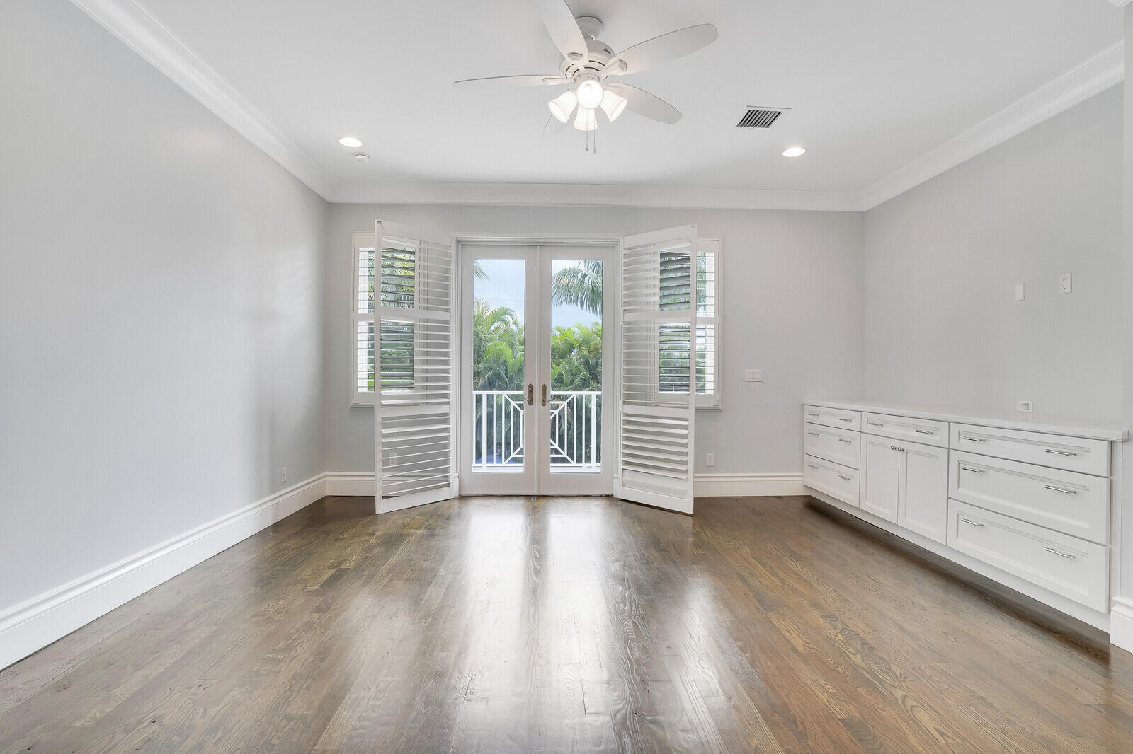 200 Northwest 10th Street Boca Raton, FL 33432 - Photo 37 of 76 an empty room with wooden floor and windows