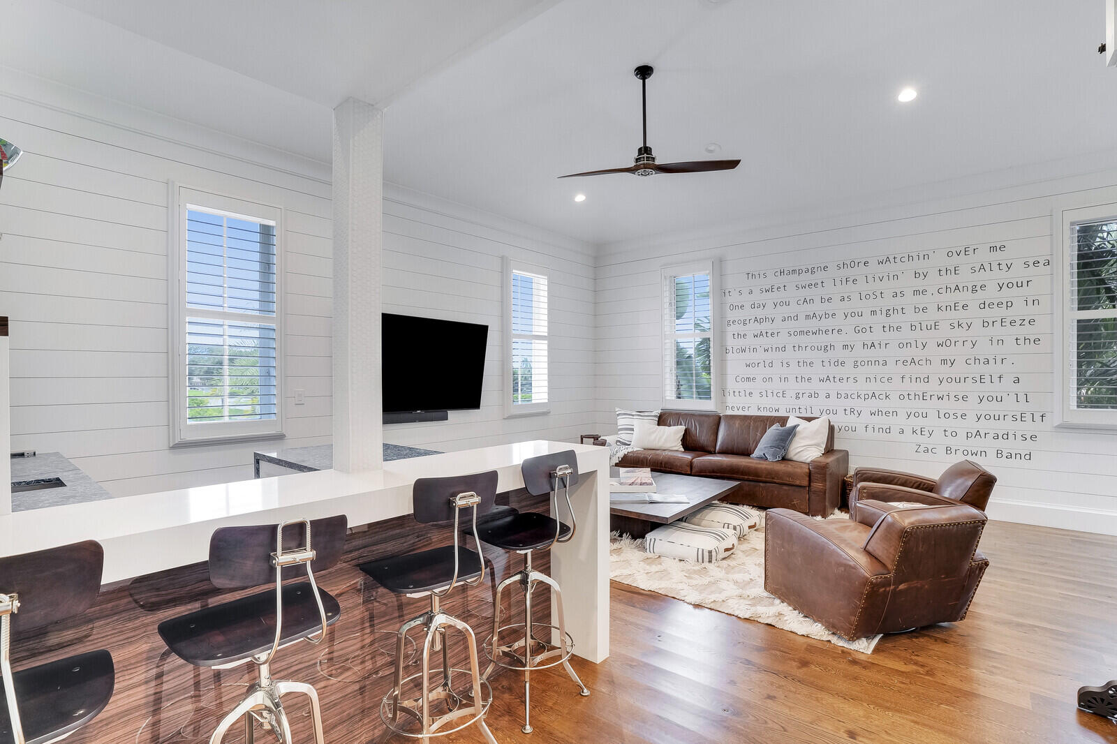 200 Northwest 10th Street Boca Raton, FL 33432 - Photo 39 of 76 a living room with furniture wooden floor and a flat screen tv