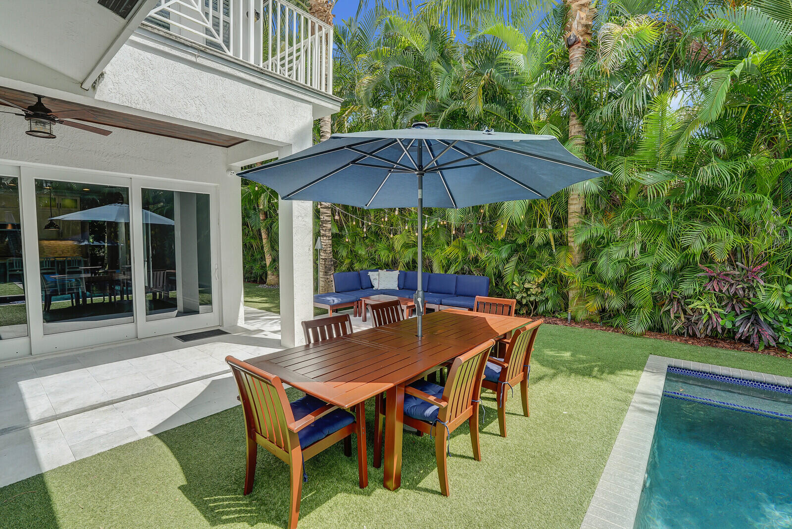 200 Northwest 10th Street Boca Raton, FL 33432 - Photo 54 of 76 a backyard of a house with table and chairs