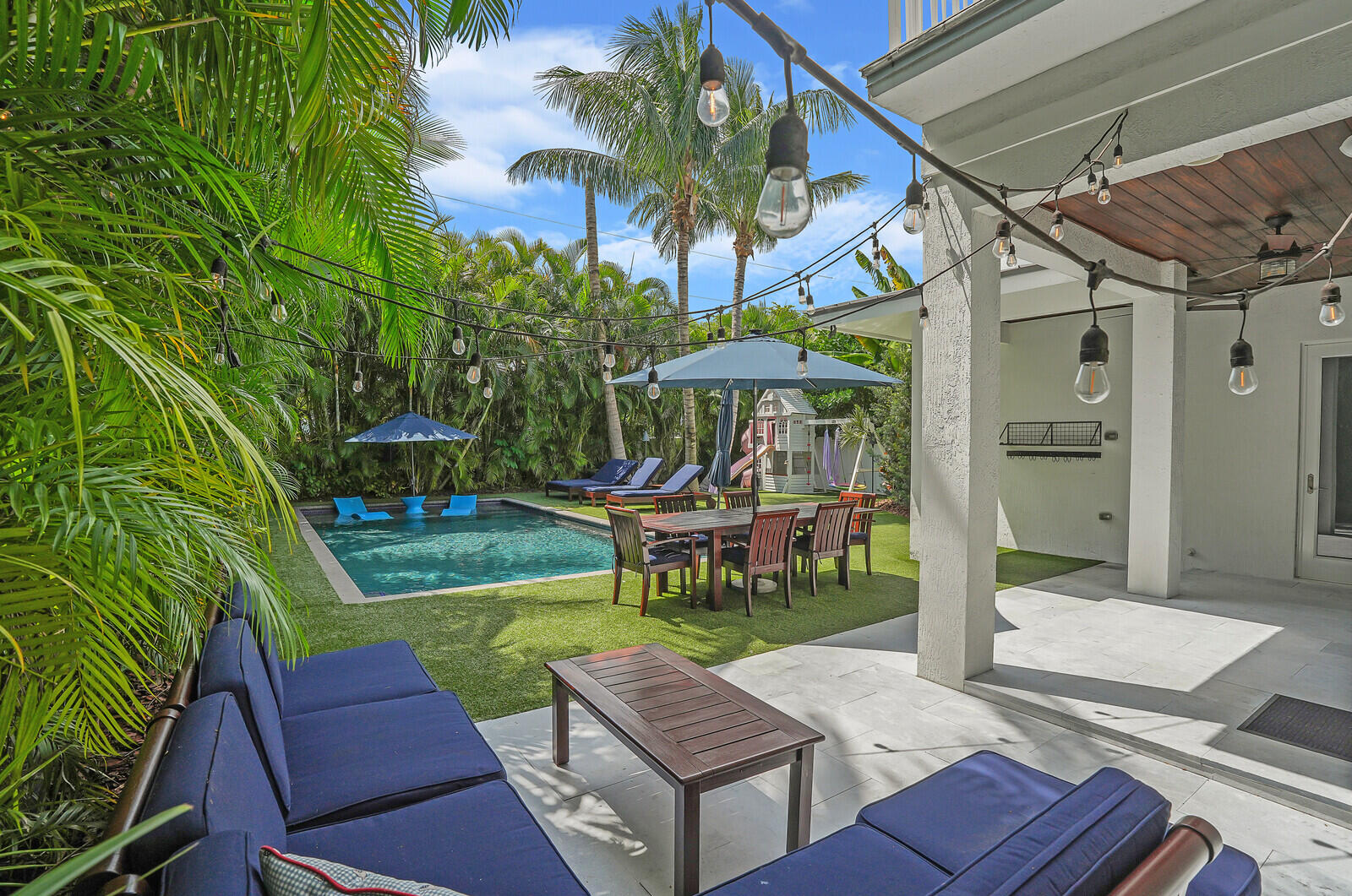 200 Northwest 10th Street Boca Raton, FL 33432 - Photo 55 of 76 a view of a chairs and table in backyard of the house