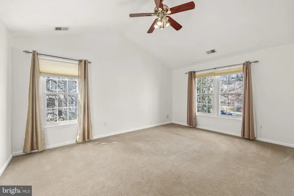a spacious bathroom with a sink and a mirror