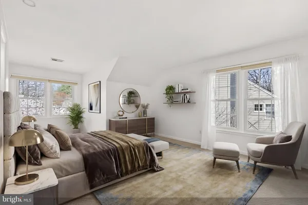 a living room with a couch and a rug