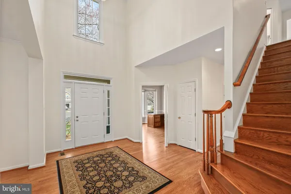a room with wooden floor and furniture