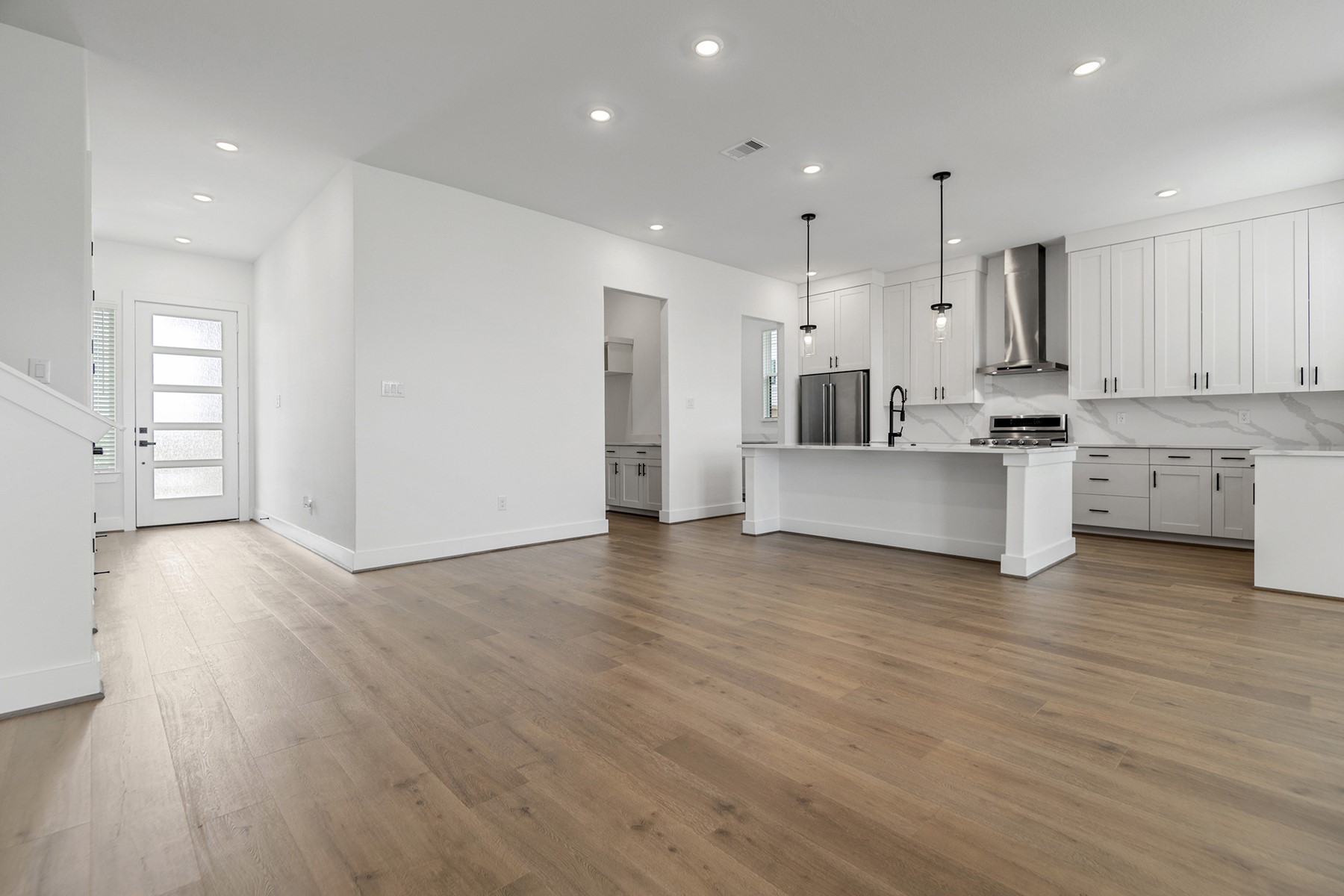 1809 Drover Lane Rosenberg, TX 77471 - Photo 5 of 21 a view of kitchen with kitchen island wooden floors appliances and cabinets