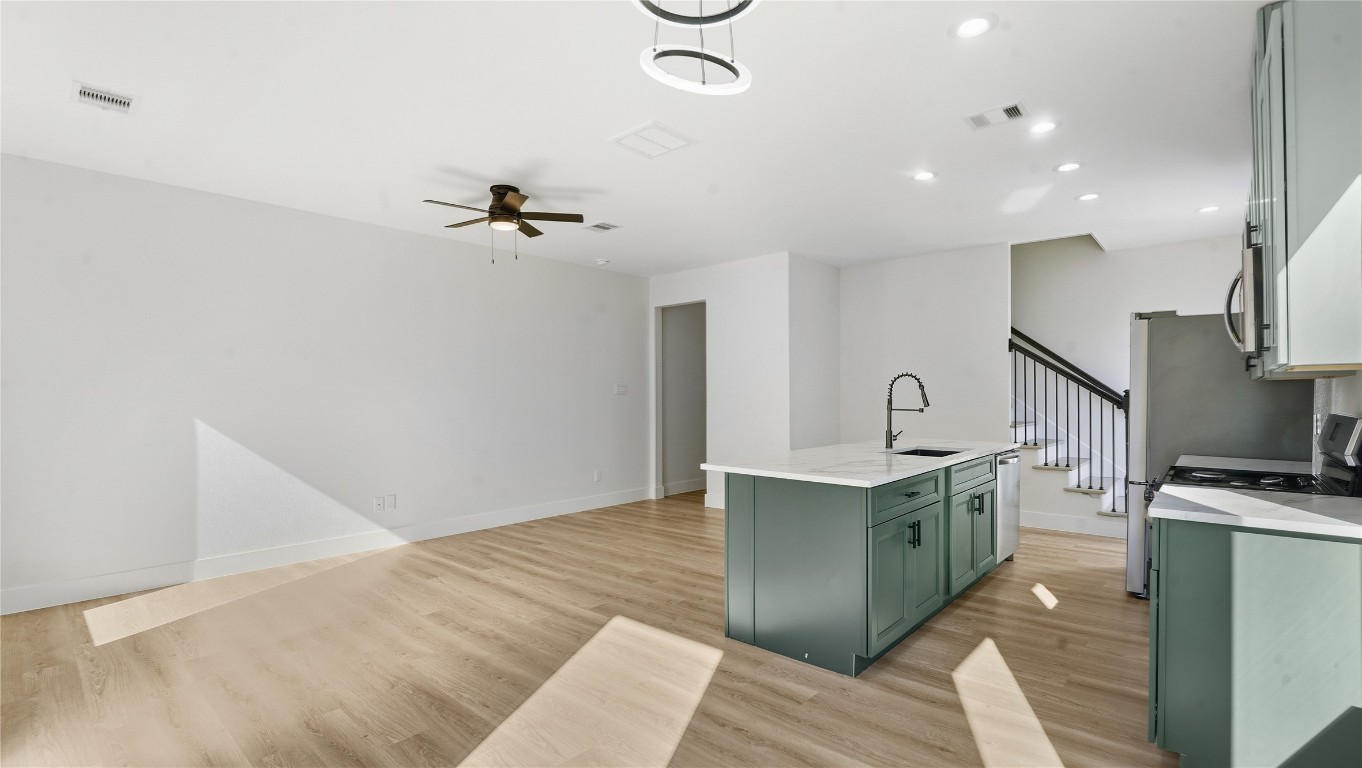 1315 Knight Street, Unit 2 Houston, TX 77022 - Photo 3 of 4 a kitchen with stainless steel appliances granite countertop a sink and a stove