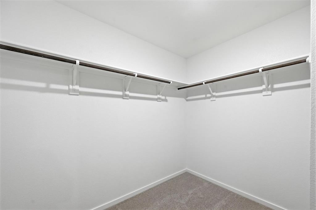 7709 Rutherford Lane McKinney, TX 75071 - Photo 12 of 23 a view of an empty walk in closet