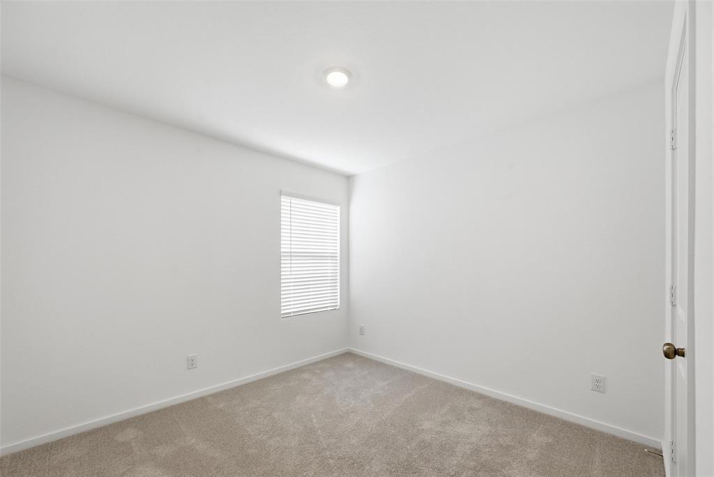 7709 Rutherford Lane McKinney, TX 75071 - Photo 16 of 23 an empty room with a window