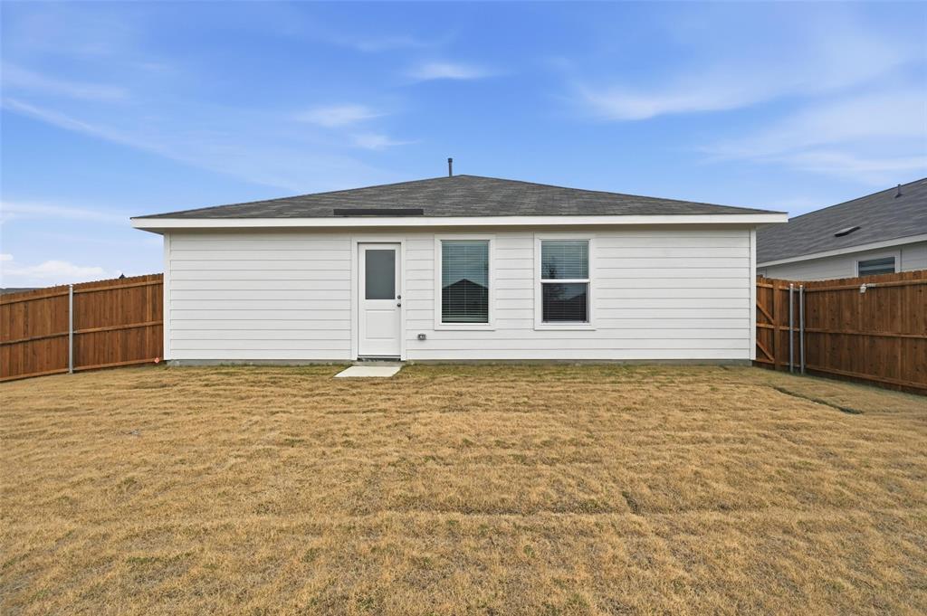 7709 Rutherford Lane McKinney, TX 75071 - Photo 18 of 23 a front view of a house with a yard