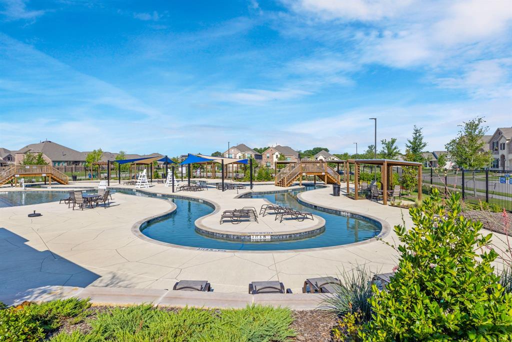 7709 Rutherford Lane McKinney, TX 75071 - Photo 20 of 23 a swimming pool with outdoor seating and city view