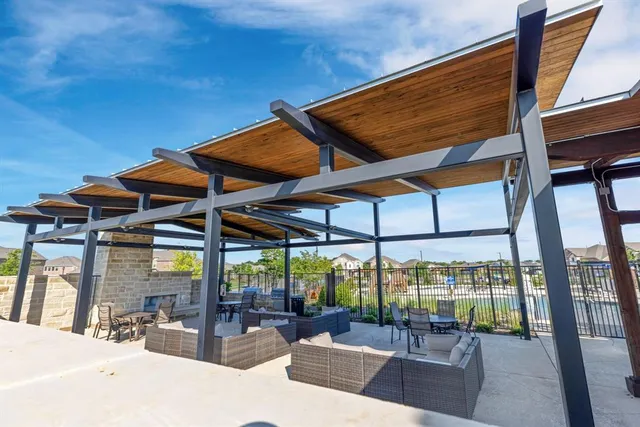 a view of a swimming pool with a patio