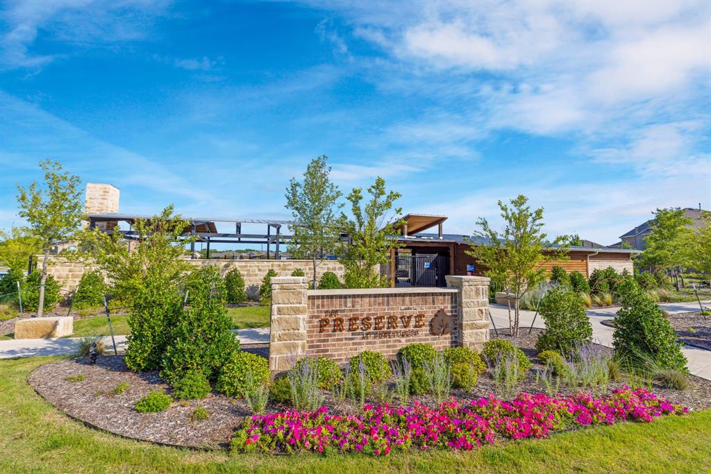 7709 Rutherford Lane McKinney, TX 75071 - Photo 22 of 23 a view of a house with fountain and garden