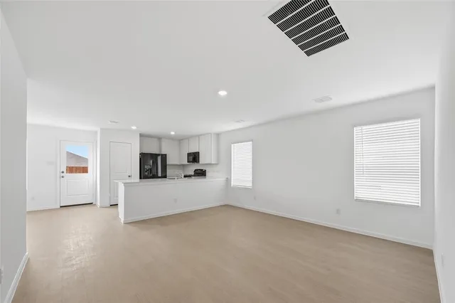 a view of a kitchen with furniture and window