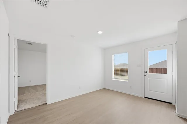 an empty room with windows