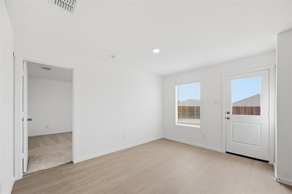 7709 Rutherford Lane McKinney, TX 75071 - Photo 8 of 23 an empty room with windows