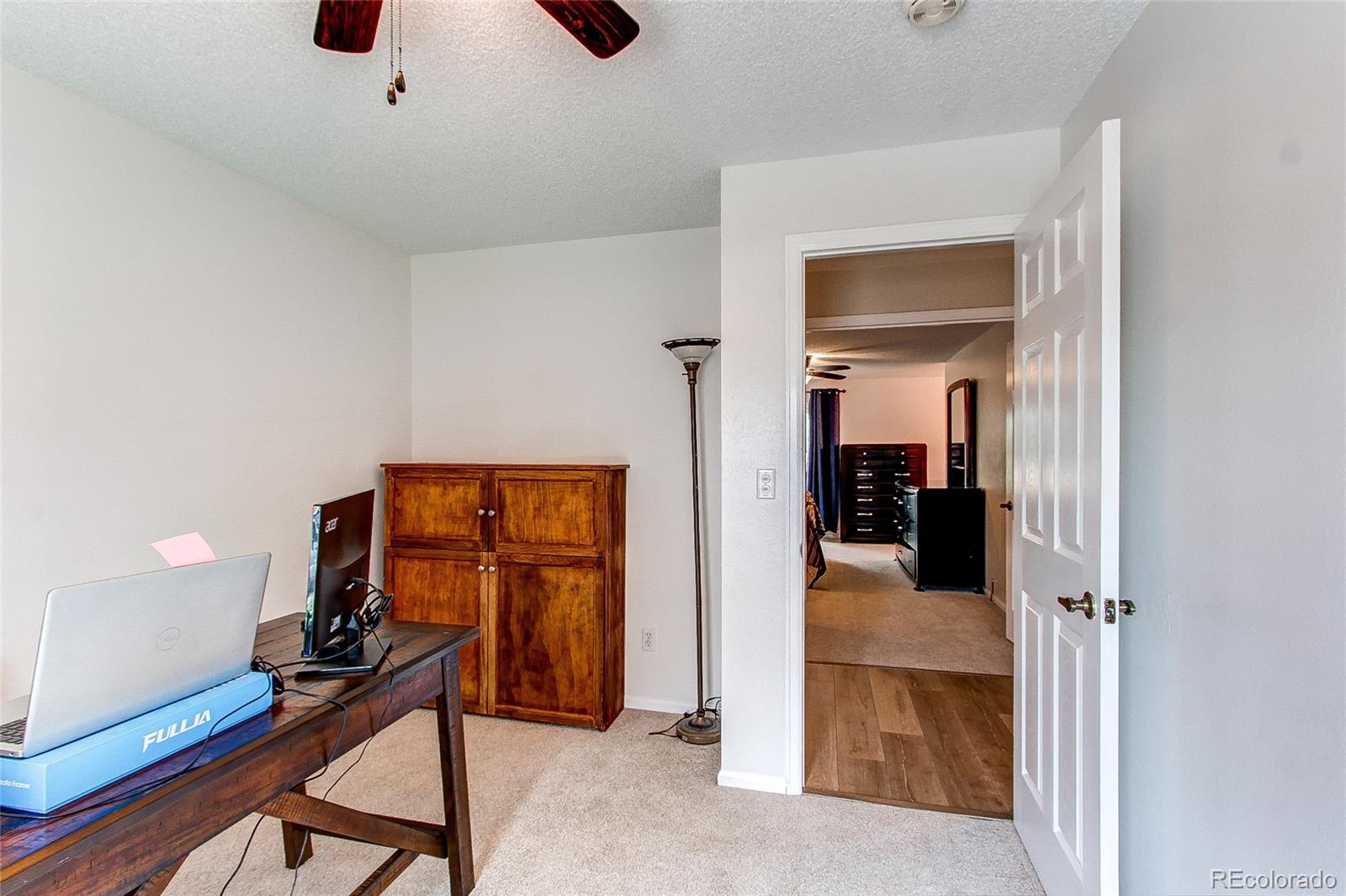 19231 East Rice Drive Aurora, CO 80015 - Photo 19 of 40 a view of a hallway with workspace