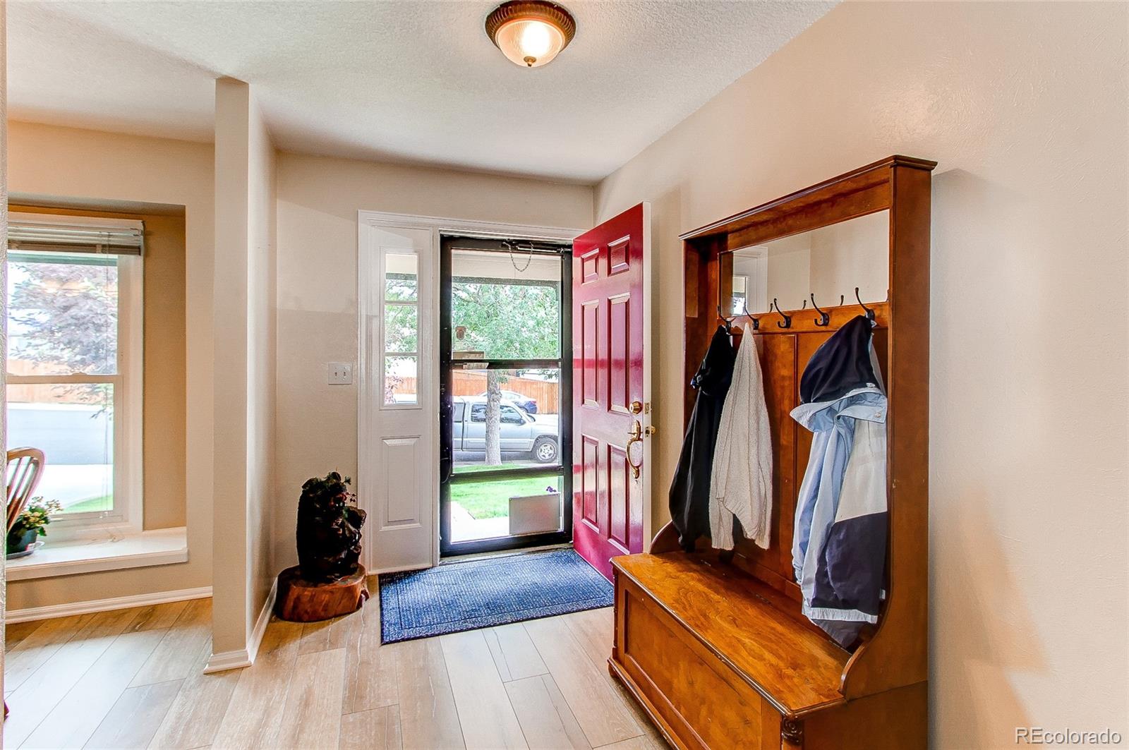 19231 East Rice Drive Aurora, CO 80015 - Photo 2 of 40 a view of an entryway with wooden floor