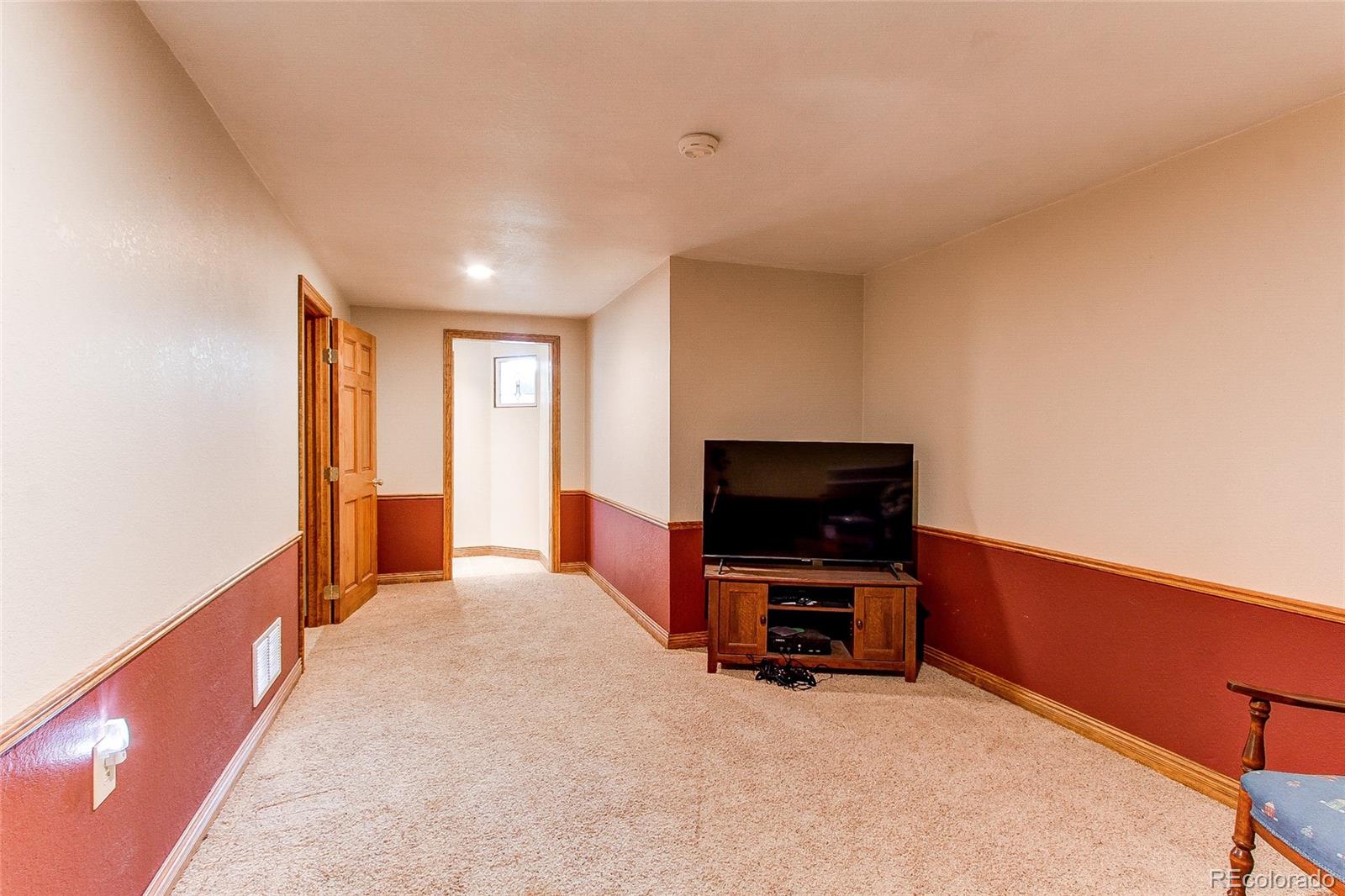 19231 East Rice Drive Aurora, CO 80015 - Photo 24 of 40 a view of livingroom with furniture and tv