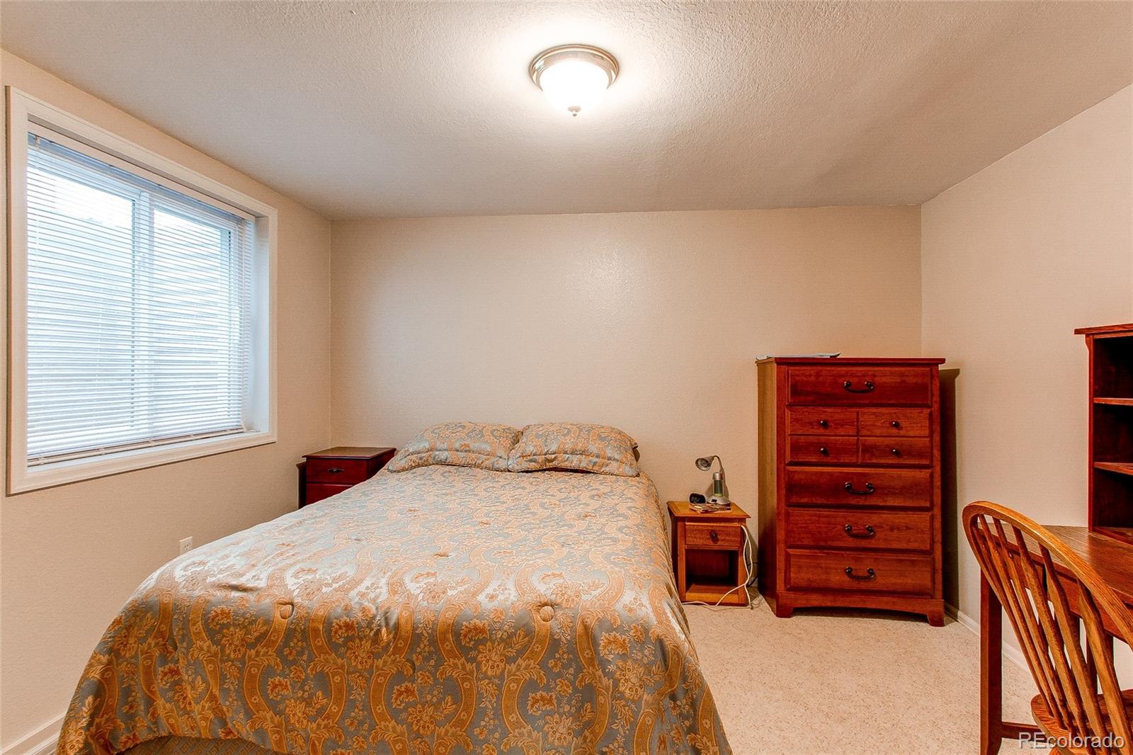 19231 East Rice Drive Aurora, CO 80015 - Photo 27 of 40 a bedroom with a bed and a closet