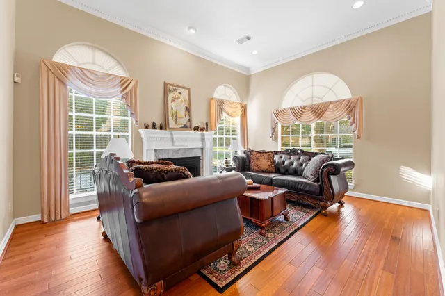 a living room with furniture and a fireplace