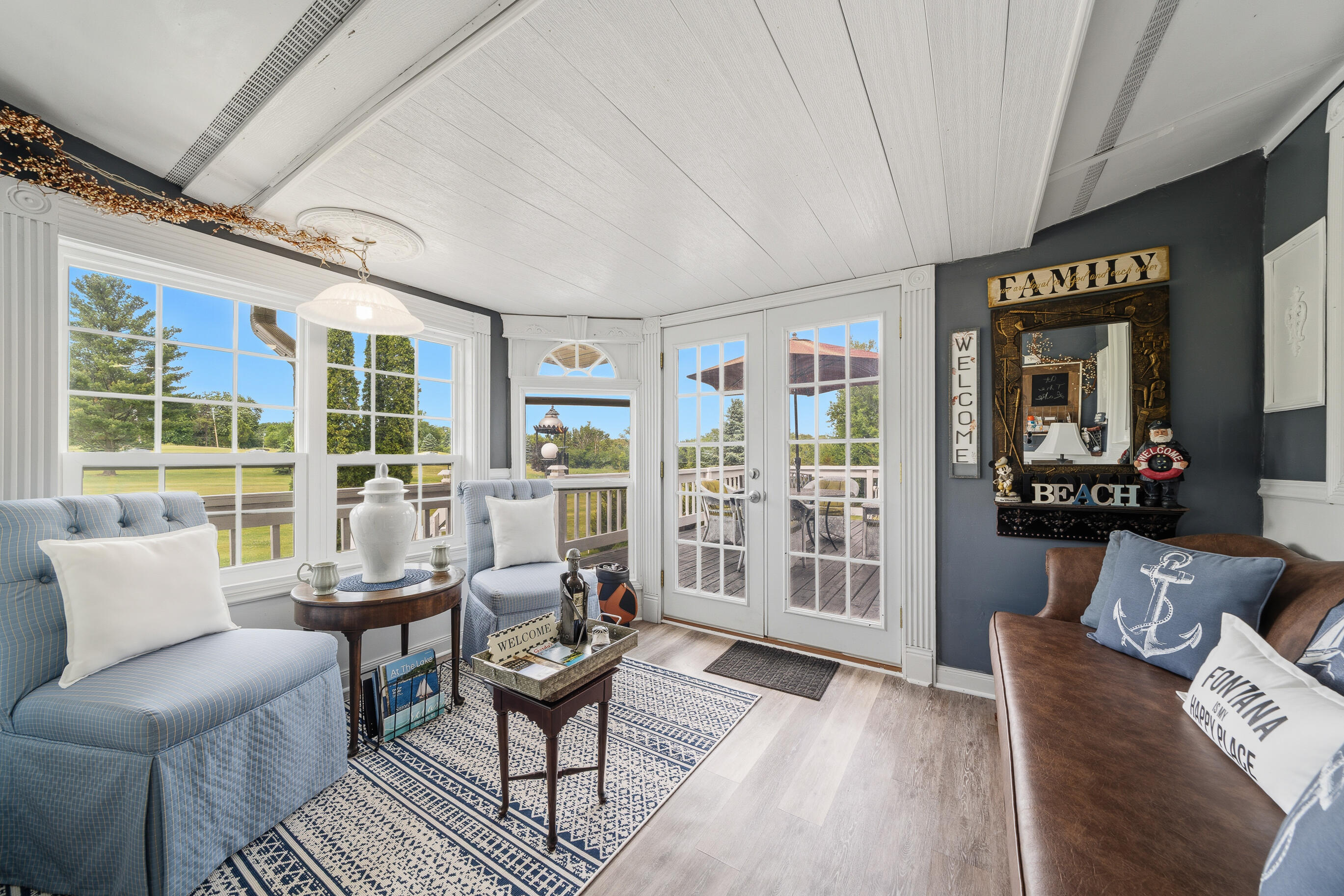 262 Castle Terrace Avenue Fontana, WI 53125 - Photo 10 of 38 Living Room Opens to Three Season Porch