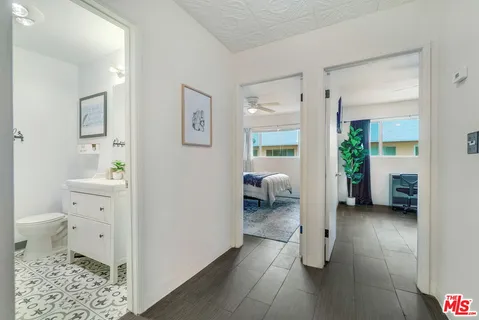 a en suite bathroom with a toilet sink and a closet